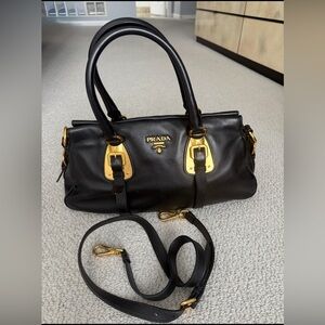 Prada Black leather (soft) and Gold hardware bag in prestine condition.